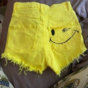 Smiley face yellow jean shorts